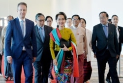 Myanmar's State Counsellor Aung San Suu Kyi departs from Naypyidaw International Airport ahead of her appearance at the International Court of Justice to defend the country against charges of genocide of its Rohingya Muslim minority, in Naypyidaw, Myanmar