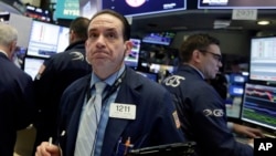 Trader Tommy Kalikas works on the floor of the New York Stock Exchange, Feb. 5, 2018.