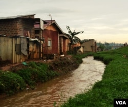Irrigation ditches built to close to homes often lead to flooding in low lying homes. (E. Paulat/VOA)
