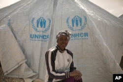 In this March 31, 2019, photo, Gailon Lawson, from Trinidad and Tobago, poses for a portrait at Al-Hol camp in Hassakeh province, Syria. (AP Photo/Maya Alleruzzo)