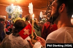A festival participant arriving at Helvetia's community hall.