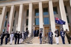 Defense Secretary Lloyd Austin stands with Australian Minister of Defense Peter Dutton during a ceremony at the Pentagon in Washington, Wednesday, Sept. 15, 2021.
