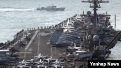 U.S. aircraft carrier USS Carl Vinson arrives for an annual joint military exercise called "Foal Eagle" between South Korea and U.S, at the port of Busan, South Korea, March 15, 2017.