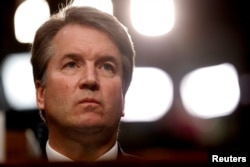 FILE - U.S. Supreme Court nominee Brett Kavanaugh listens during his Senate Judiciary Committee confirmation hearing on Capitol Hill in Washington, September 4, 2018.