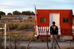A law enforcement vehicle leaves the Bonanza Creek Film Ranch in Santa Fe, N.M. Friday, Oct. 22, 2021. Actor Alec Baldwin fired a prop gun on the set of a Western being filmed at the ranch on Thursday, Oct. 21, killing the cinematographer, officials said.