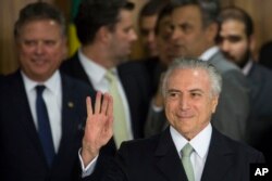 Brazil's acting President Michel Temer arrives to speak, at Planalto presidential palace in Brasilia, Brazil, Thursday, May 12, 2016.