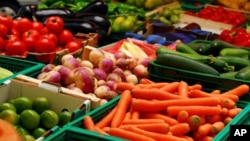 Fresh assorted vegetables in boxes at a farmers' market. (FILE PHOTO)