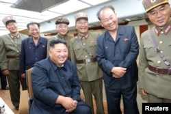 North Korean leader Kim Jong Un guides the test firing of a new weapon, in this undated photo released on August 11, 2019 by North Korea's Korean Central News Agency (KCNA).