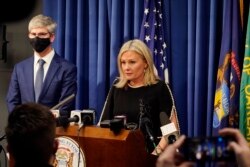 Oakland County prosecutor Karen McDonald addresses the media in her office, Friday, Dec. 3, 2021, in Pontiac, Mich. (AP Photo/Carlos Osorio)