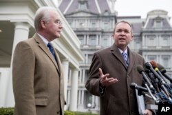 Budget Director Mick Mulvaney, right, joined by Health and Human Services Secretary Tom Price, outside the White House Monday.