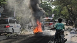 A fire burns on the street during a protest against the military coup, in Mandalay, Myanmar April 1, 2021. REUTERS/Stringer