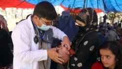 Internally displaced Afghans from northern provinces, who fled their home due to fighting between the Taliban and Afghan security personnel, receive medical care after taking refuge in a public park in Kabul, Afghanistan, Tuesday, Aug. 10, 2021. (AP Photo