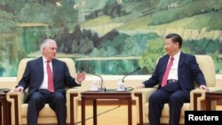 Chinese President Xi Jinping (R) shakes hands with U.S. Secretary of State Rex Tillerson before their meeting at at the Great Hall of the People on March 19, 2017 in Beijing, China.