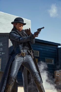 This image released by Netflix shows Regina King in a scene from 'The Harder They Fall.' (David Lee via AP)
