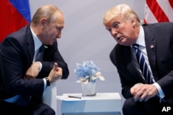 President Donald Trump meets with Russian President Vladimir Putin at G-20 Summit in Germany on July 7, 2017.