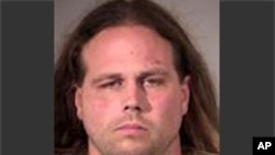 This booking photo provided by Multnomah County Sheriff's Office in Portland, Ore., shows Jeremy Joseph Christian.