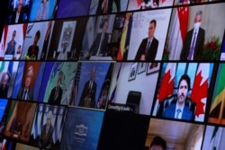 World leaders appear on screen during a virtual Climate Summit, seen from the East Room at the White House in Washington, U.S., April 22, 2021. (REUTERS/Tom Brenner)