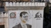 ARCHIVO - Esta fotografía aérea muestra un retrato acribillado a balazos del presidente sirio Bashar al-Assad adornando el edificio del municipio de Hama después de que fuera profanado tras la captura de la ciudad por combatientes antigubernamentales, el 6 de diciembre de 2024.