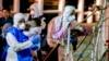 Migrants Arriving in Italy Find an 'Angel'