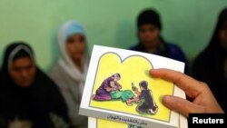 Cards are used to teach women about female genital mutilation.