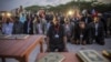 FILE - New Somali parliamentarians pray during an inauguration ceremony for members of Somalia's first parliament in 20 years in Mogadishu, Aug. 20, 2012.