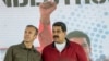 Maduro junto al vicepresidente Tareck El Aissami durante un evento con trabajadores de PDVSA enCaracas, el 31 de enero de 2017. 