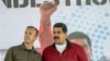 Venezuelan President Nicolas Maduro (R) and his Vice En la lista de sancionados destaca además de Maduro, el vicepresidente ejecutivo, Tareck El Aissami, quien cuestionó que se refieran a Venezuela como dictadura cuando la oposición se prepara para participar en un proceso electoral el próximo 15 de octubre.