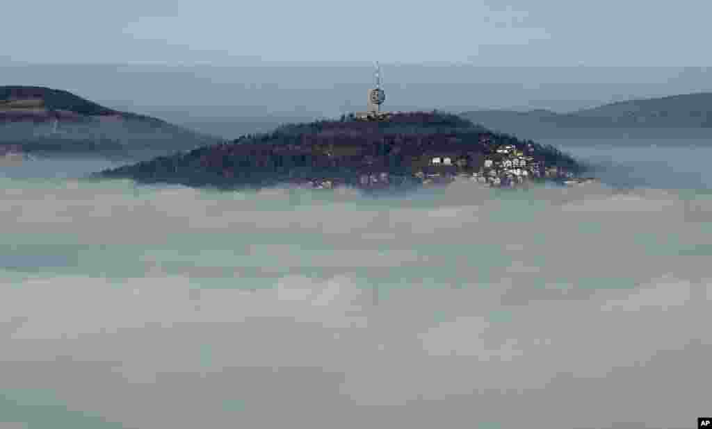 The Bosnian capital of Sarajevo is seen covered by layers of fog.