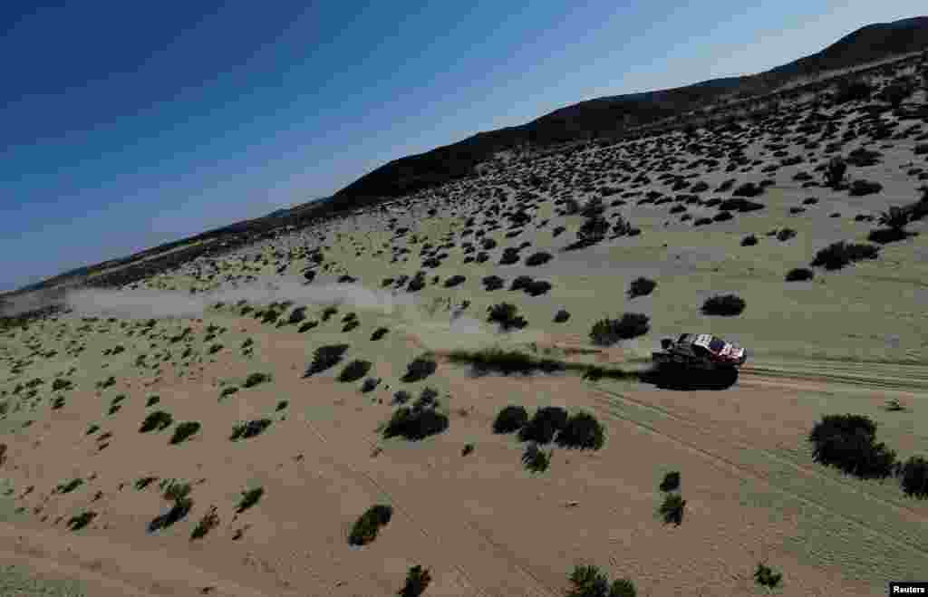 Toyota Gazoo Racing's Nasser Al-Attiyah and Co-Driver Matthieu Baumel compete during Stage 1 of the Dakar Rally between Jeddah and Bisha in Saudi Arabia.