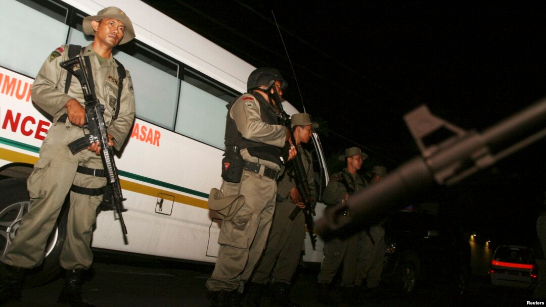 Indonesia's anti-terror police stand guard at the site of a shooting at a hotel in Sanur on the Indonesian island of Bali, March 18, 2012.