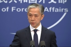 Chinese foreign ministry spokesman, Wang Wenbin, speaks during a press conference where he congratulated U.S. president-elect Joe Biden.