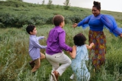 Comfort Dondo with her children. (Photo by Rebecca Parks)