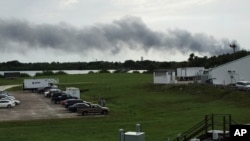 Smoke rises from a SpaceX launch site Thursday, Sept. 1, 2016, at Cape Canaveral, Fla. NASA said SpaceX was conducting a test firing of its unmanned rocket when a blast occurred. 
