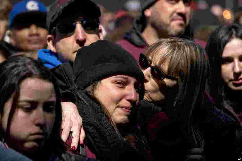 Members of the audience become emotional as Edna Chavez, of Manual Arts High, south of downtown Los Angeles, speaks during the "March for Our Lives" rally in support of gun control in Washington, Saturday, March 24, 2018. (AP Photo/Andrew Harnik)