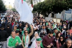 Demonstrators shout slogans during an anti-government rally in Algiers, Algeria December 27, 2019. REUTERS/Ramzi Boudina